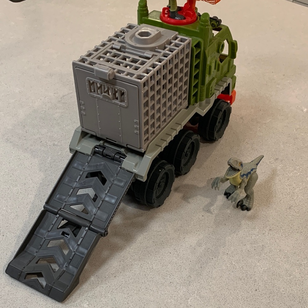 Fisher-Price Imaginext - Action Truck with Soldier and Dinosaur.